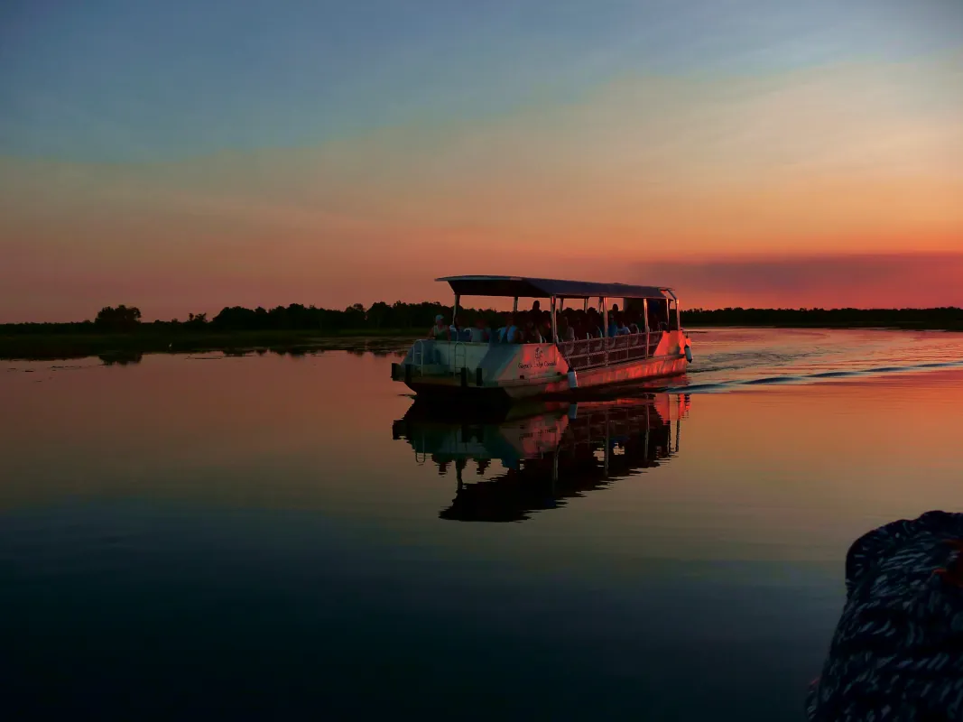 It is sunset, and it is time to apply mosquito repellent. Yellow River Cruise Kakadu National Park Australia