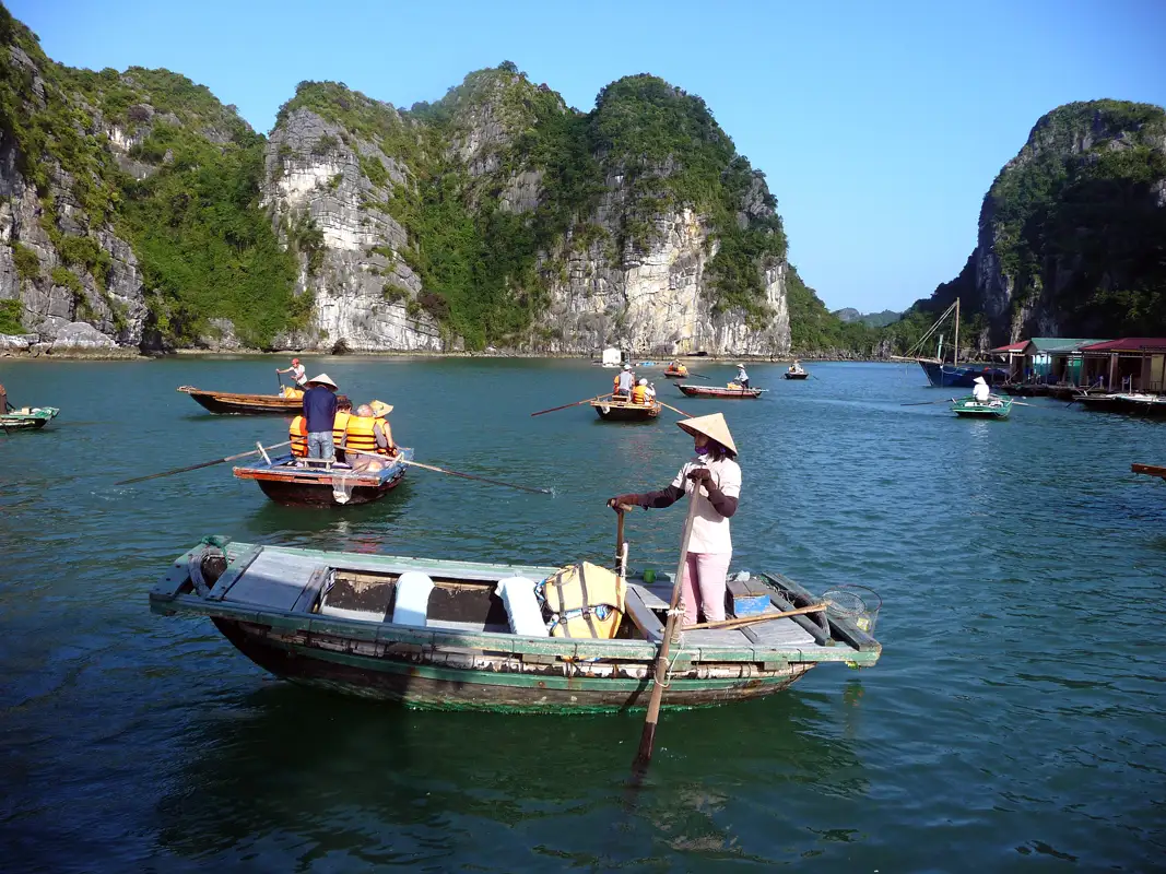 We went on another excursion from our Halong Bay cruise ship. Little boats picked us up and rowed us to a floating fishing village and a pearl farm. Guess who did the rowing? Vietnam's women!!