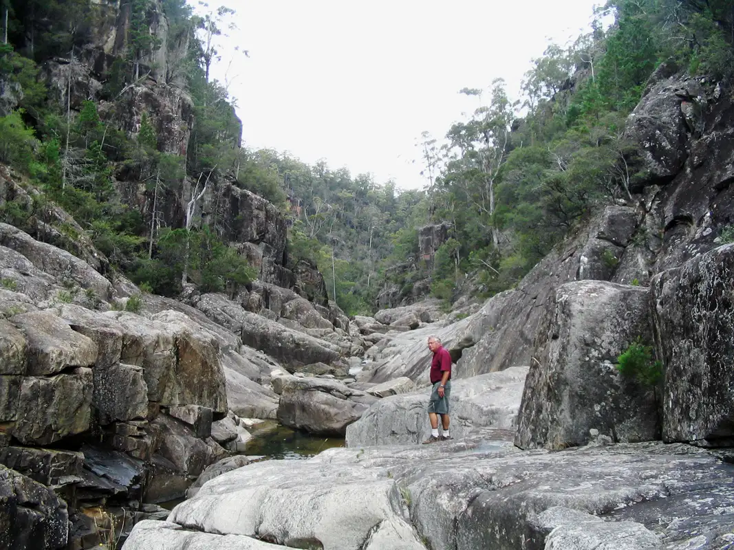 Located in the Douglas-Apsley National Park, a short drive from Bicheno on Tasmania's east coast, is the challenging Apsley Gorge Circuit hiking trail. The eight-kilometer, four-hour walk starts with an easy walk through the forest and ends with a tough scramble through deep river gullies, passing waterfalls and waterholes.Finding the river bed's exit was quite difficult for us.Tasmania