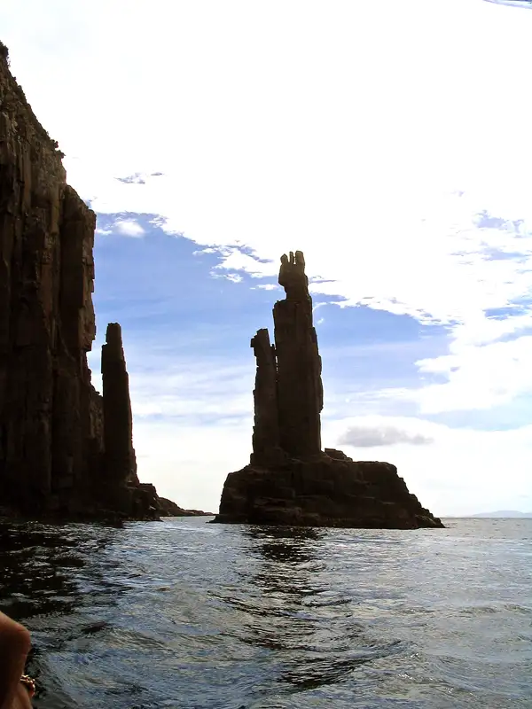 Bruny Island has a spectacular coastline with large caves carved into the high cliff.