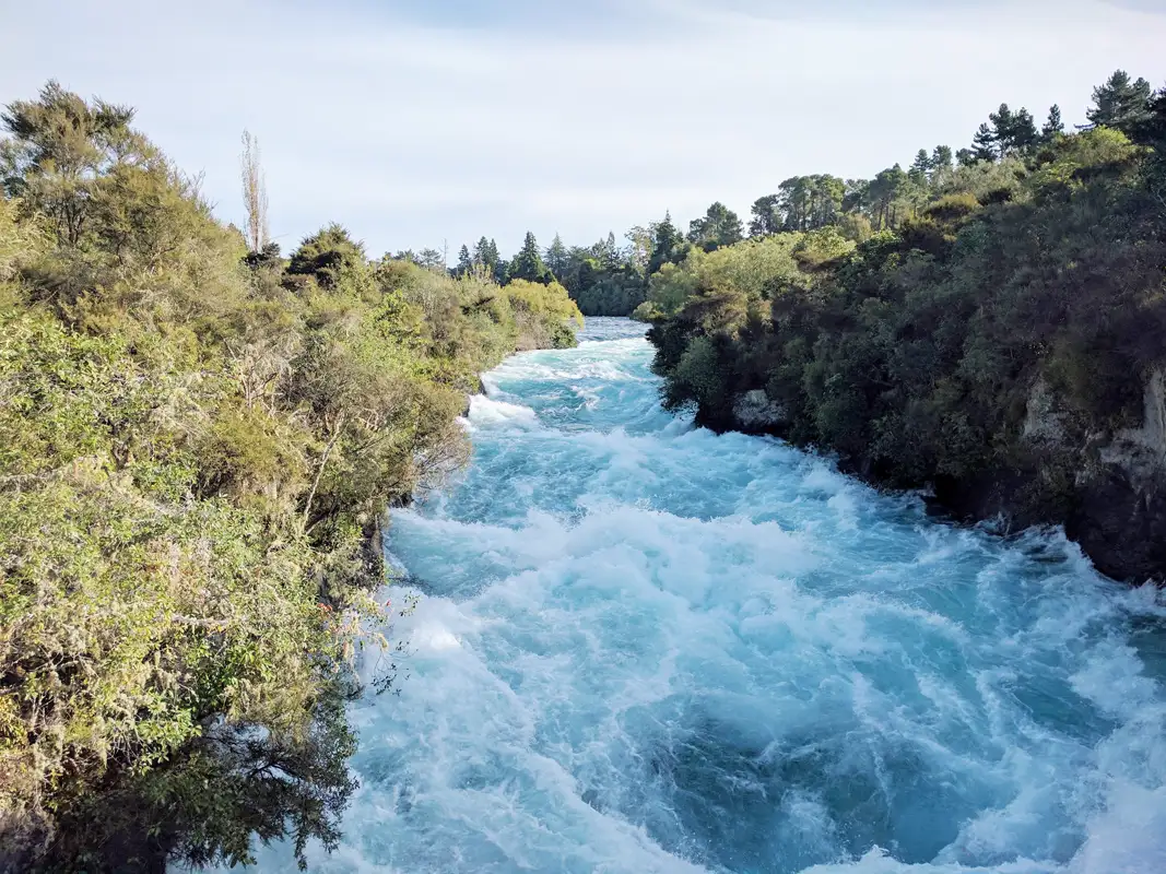 New Zealands longest river originates on the slopes of Mt Ruapehu and flows through Lake Taupo before blasting through a narrow rock chasm to create the Huka Falls. It then flows peacefully northwards towards Port Waikato.