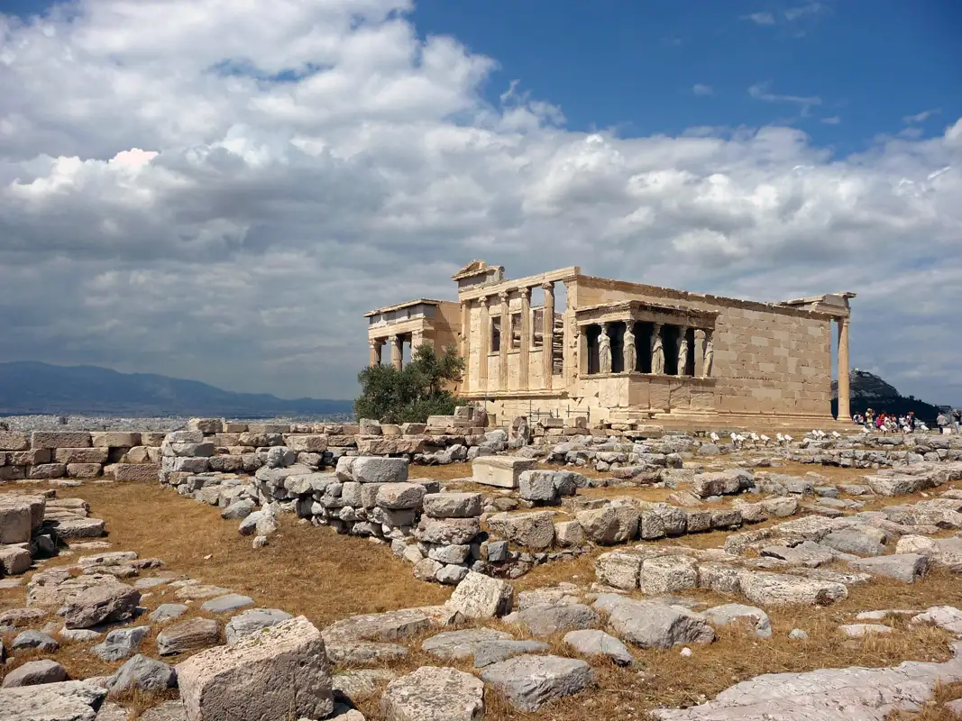 While walking around, we explored the Odeon of Herodes Atticus. We also saw the wonderful Erechtheum. Later, we took shots of the city below.