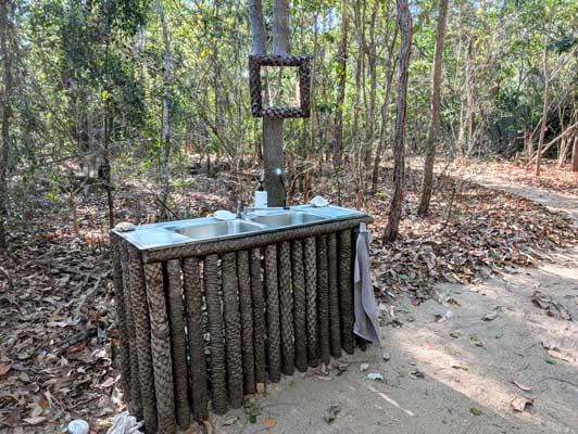 Wash your hands — at a beautifully designed vanity in the bush