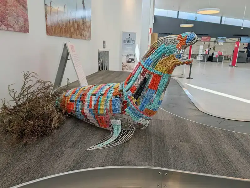 A colourful sculpture of a seal at Kingscote airport