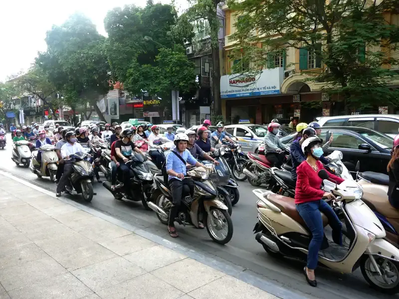 Hanoi street traffic with thousands of scooters in Vietnam