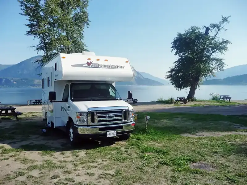 Motorhome campsite with scenic mountain views on the road to Banff National Park during a Canadian Rockies RV road trip.