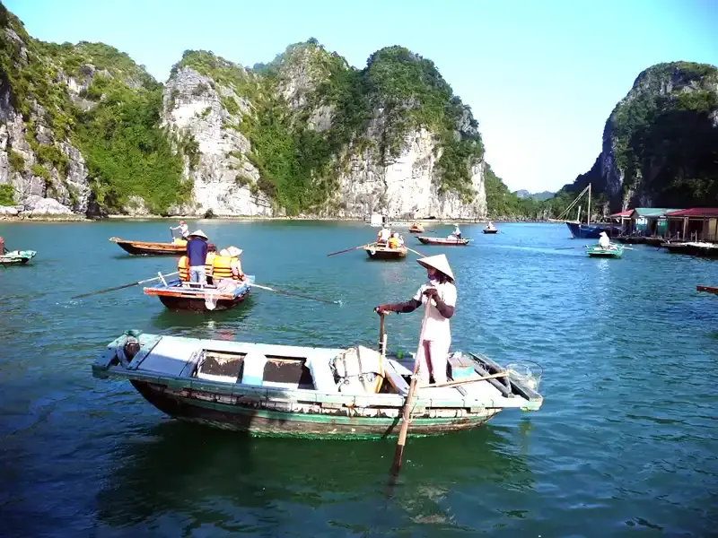 A small traditional rowboats at ship to a pearl farm in Ha Long Bay