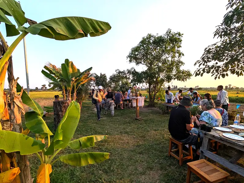 cocktails and snacks while watching the sun set over the tranquil rice fields in peaceful Cambodian countryside