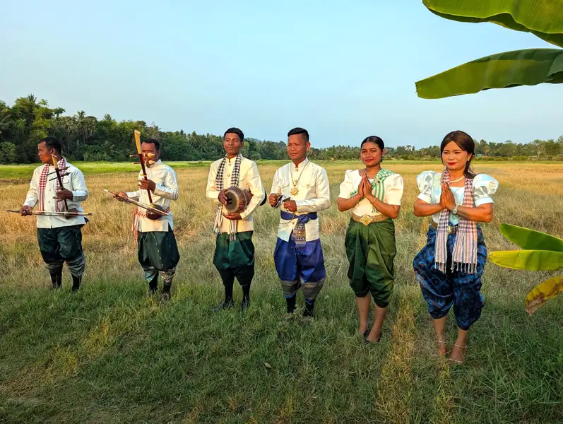 a small band, dressed in colourful traditional costumes, entertained us with local music and songs. at the cocktail party in the rice fields
