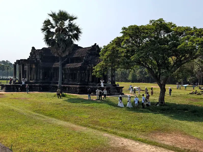 Locals enjoying picnics on the beautifully maintained lawns at Angkor Wat