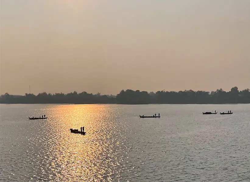 peaceful scenes on the Mekong River, small fishing boats